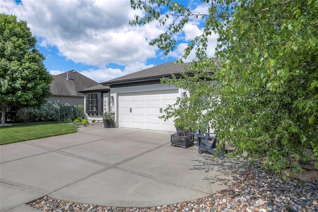1644 Woodland Shores Cir, Lees Summit, MO 64086 - view of side of home with driveway, a garage, a shingled roof, and stucco siding