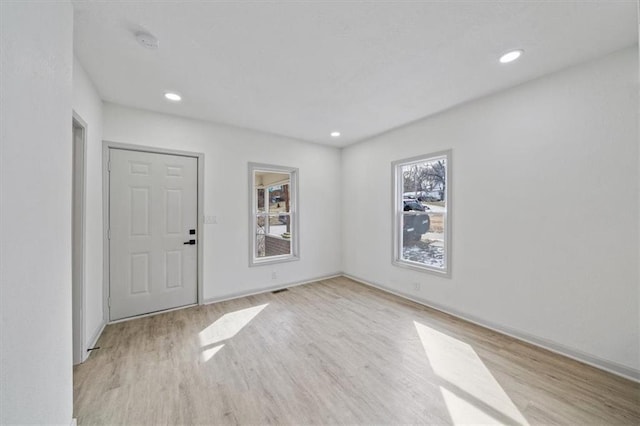 1514 N 25th St, Kansas City, KS 66102 - foyer entrance with wood finished floors, baseboards, and recessed lighting