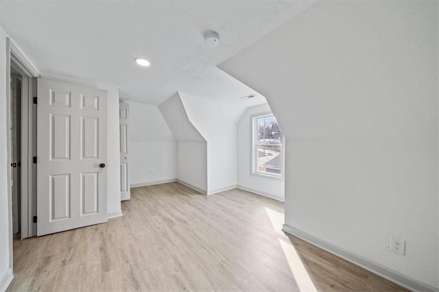 1514 N 25th St, Kansas City, KS 66102 - additional living space with baseboards, light wood finished floors, recessed lighting, and lofted ceiling