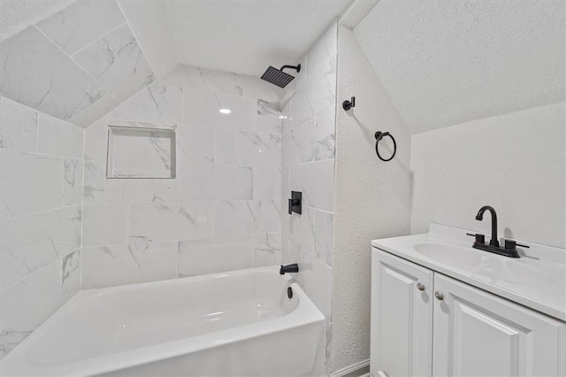 1514 N 25th St, Kansas City, KS 66102 - full bath with lofted ceiling,  shower combination, vanity, and a textured wall