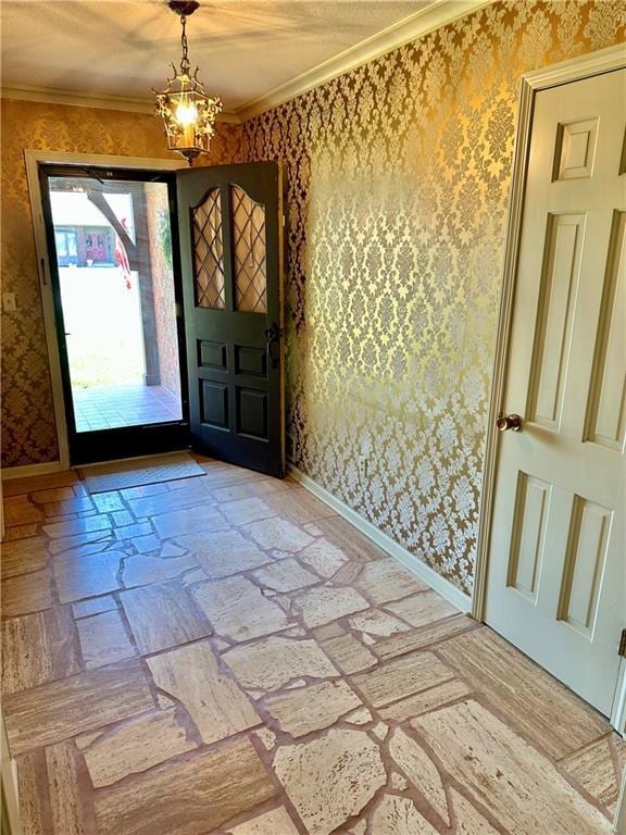 917 Country Club Dr, Butler, MO 64730 - entrance foyer featuring wallpapered walls, a chandelier, and crown molding