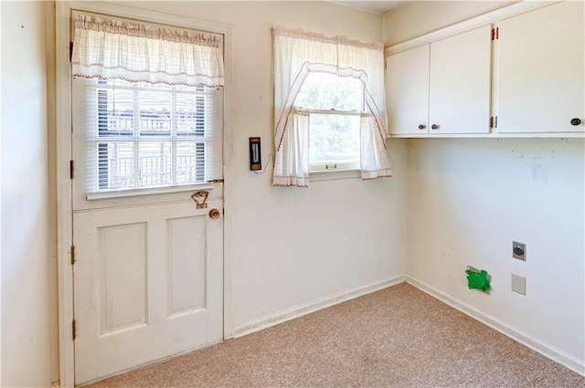 917 Country Club Dr, Butler, MO 64730 - doorway featuring plenty of natural light and light carpet