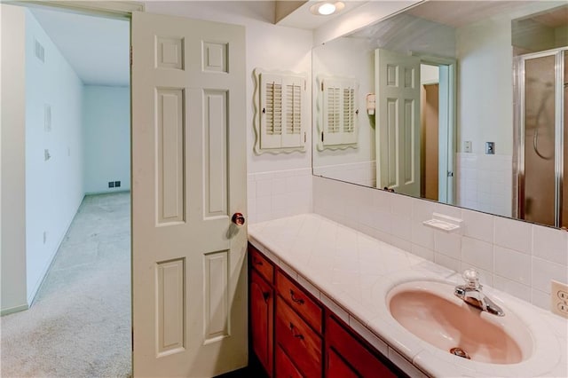 917 Country Club Dr, Butler, MO 64730 - bathroom with vanity, a stall shower, and backsplash