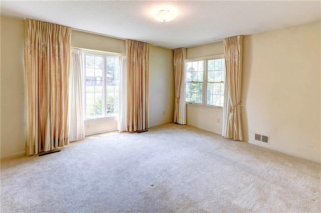917 Country Club Dr, Butler, MO 64730 - empty room featuring a textured ceiling and carpet