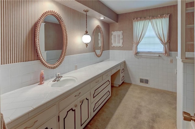 917 Country Club Dr, Butler, MO 64730 - bathroom featuring tile walls, vanity, and wainscoting