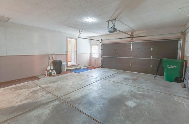 917 Country Club Dr, Butler, MO 64730 - garage with a garage door opener