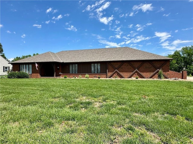 917 Country Club Dr, Butler, MO 64730 - view of front facade featuring a front lawn and brick siding