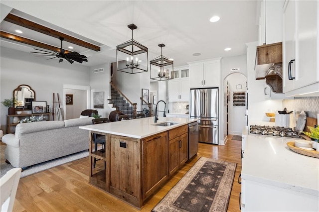 1108 NE Goshen Ct, Lees Summit, MO 64064 - kitchen with a sink, stainless steel appliances, light wood finished floors, tasteful backsplash, and recessed lighting