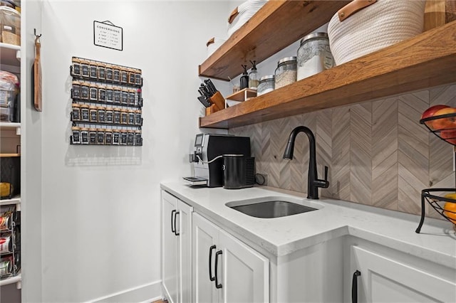 1108 NE Goshen Ct, Lees Summit, MO 64064 - bar with a sink, decorative backsplash, and baseboards