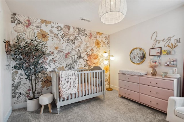 1108 NE Goshen Ct, Lees Summit, MO 64064 - bedroom featuring baseboards, a nursery area, wallpapered walls, and an accent wall