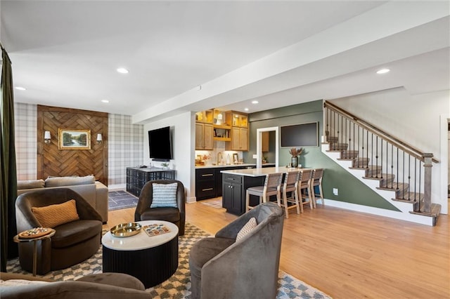 1108 NE Goshen Ct, Lees Summit, MO 64064 - living room with light wood-style flooring, baseboards, stairway, and recessed lighting