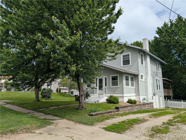 117 W N St, Warrensburg, MO 64093 - view of front of home with a chimney