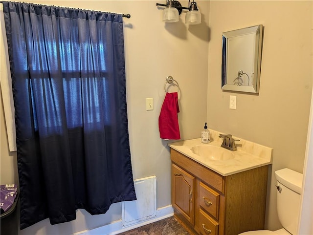 117 W N St, Warrensburg, MO 64093 - full bath featuring vanity, toilet, and shower / bath combo with shower curtain