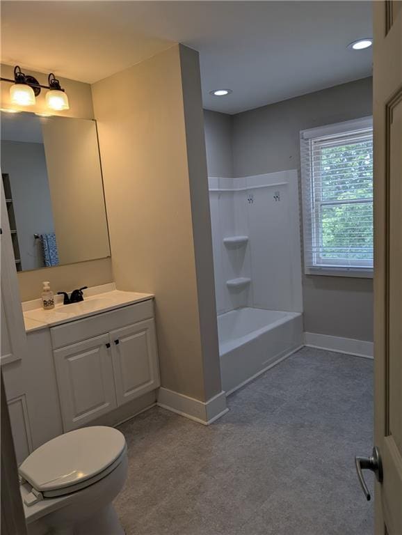 117 W N St, Warrensburg, MO 64093 - bathroom with baseboards, vanity, toilet, recessed lighting, and bathtub / shower combination