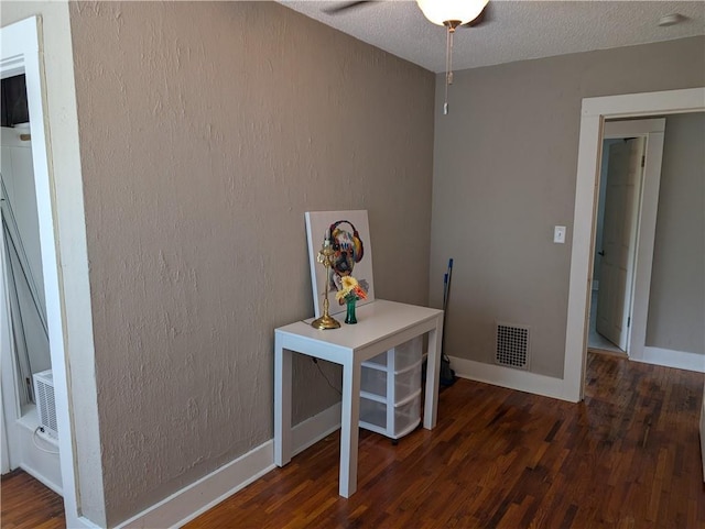 117 W N St, Warrensburg, MO 64093 - office area with wood finished floors, baseboards, ceiling fan, a textured ceiling, and a textured wall