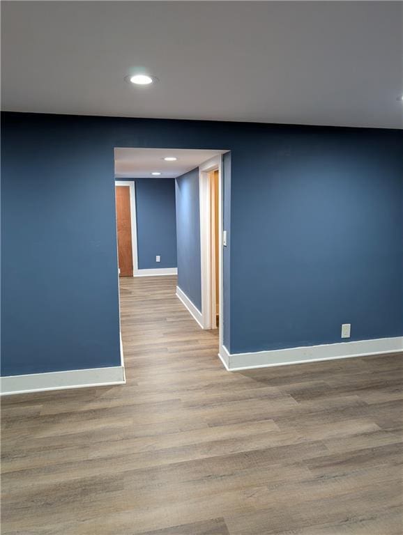 117 W N St, Warrensburg, MO 64093 - unfurnished room with baseboards, wood finished floors, and recessed lighting