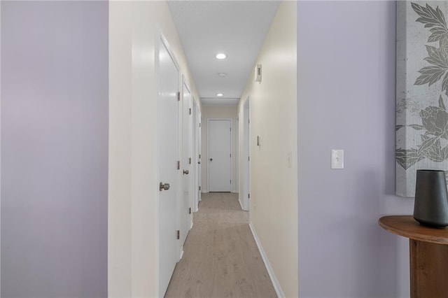 7243 Rene St, Shawnee, KS 66216 - hall featuring light wood-type flooring, recessed lighting, and baseboards