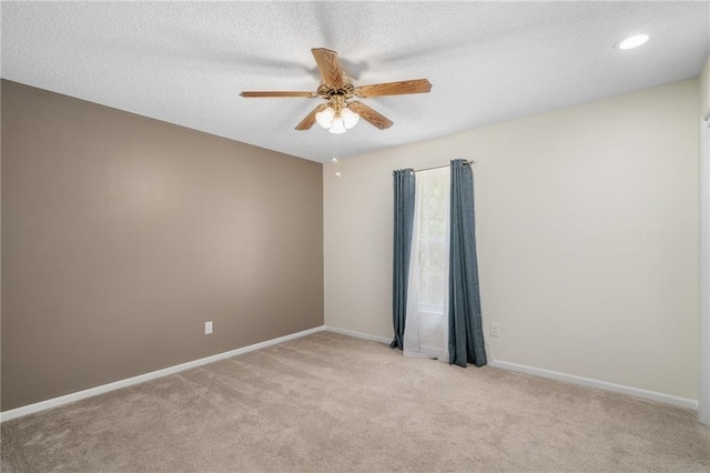 7243 Rene St, Shawnee, KS 66216 - empty room with ceiling fan, light colored carpet, baseboards, a textured ceiling, and recessed lighting