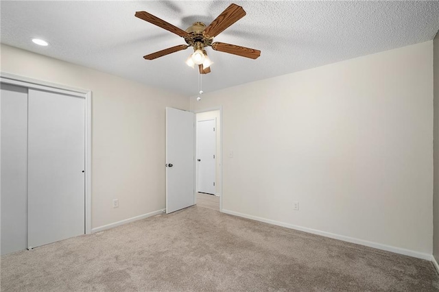 7243 Rene St, Shawnee, KS 66216 - unfurnished bedroom with light colored carpet, a closet, recessed lighting, baseboards, and a ceiling fan