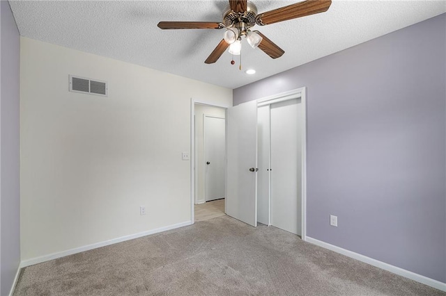 7243 Rene St, Shawnee, KS 66216 - unfurnished bedroom featuring light carpet, a closet, baseboards, recessed lighting, and a textured ceiling