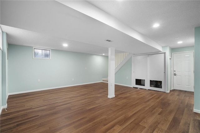 7243 Rene St, Shawnee, KS 66216 - basement with wood finished floors, baseboards, a textured ceiling, recessed lighting, and stairs