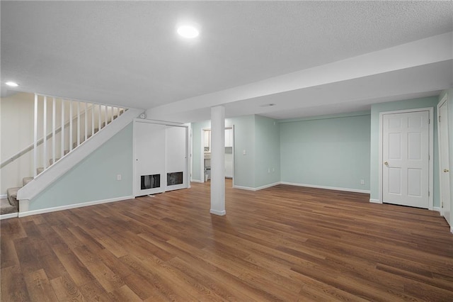 7243 Rene St, Shawnee, KS 66216 - finished basement featuring stairway, baseboards, wood finished floors, and recessed lighting