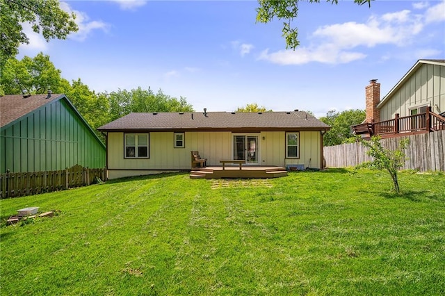 7243 Rene St, Shawnee, KS 66216 - rear view of house featuring a deck and board and batten siding