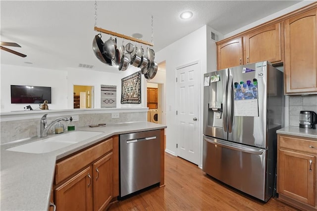22480 W 113th St, Olathe, KS 66061 - kitchen with stainless steel appliances, decorative backsplash, a sink, light countertops, and recessed lighting