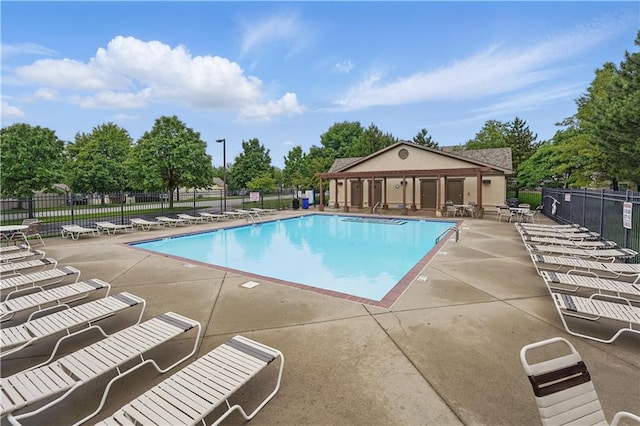 22480 W 113th St, Olathe, KS 66061 - community pool with a patio and view of scattered trees