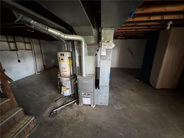 8724 N Jefferson St, Kansas City, MO 64155 - unfinished below grade area featuring water heater and heating unit
