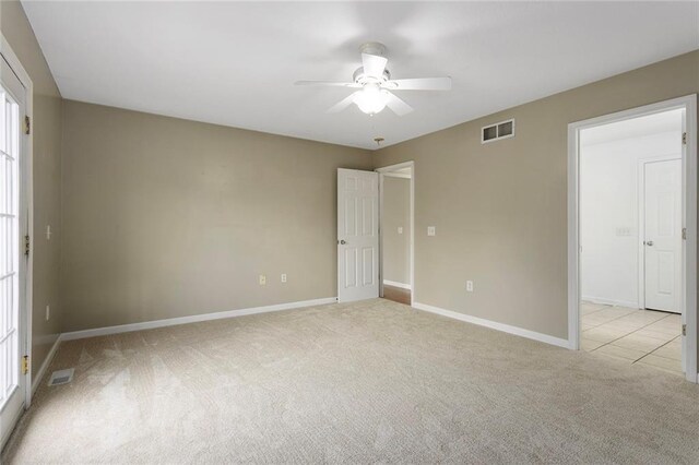 3208 Arbor Lake Dr, Saint Joseph, MO 64506 - spare room featuring ceiling fan, carpet floors, and baseboards