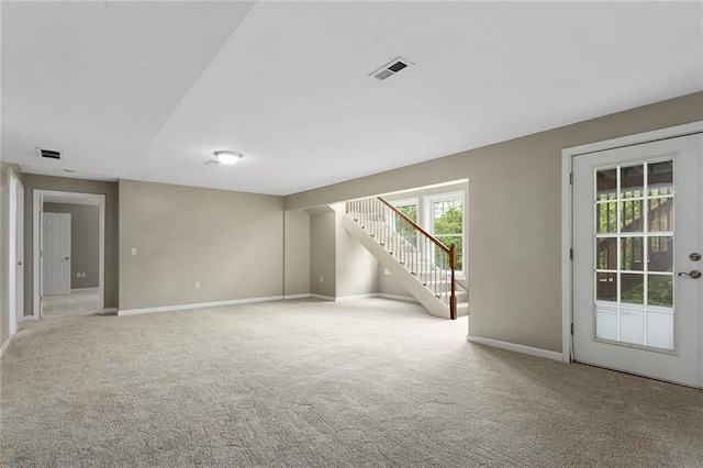 3208 Arbor Lake Dr, Saint Joseph, MO 64506 - unfurnished room with carpet, baseboards, and stairs