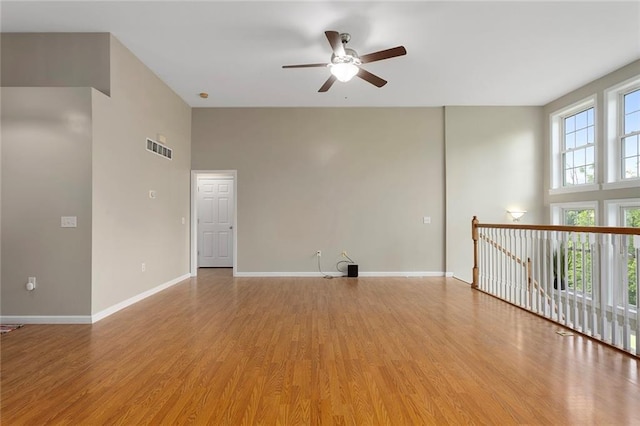 3208 Arbor Lake Dr, Saint Joseph, MO 64506 - spare room with a ceiling fan, light wood finished floors, and baseboards