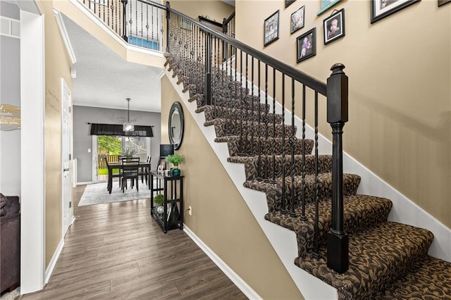9820 N Donnelly Ave, Kansas City, MO 64157 - stairs featuring wood finished floors and baseboards