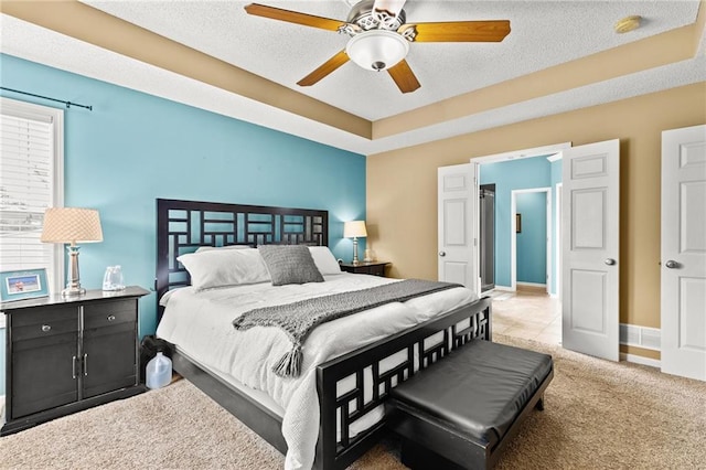 9820 N Donnelly Ave, Kansas City, MO 64157 - bedroom with carpet flooring, a textured ceiling, a ceiling fan, and baseboards