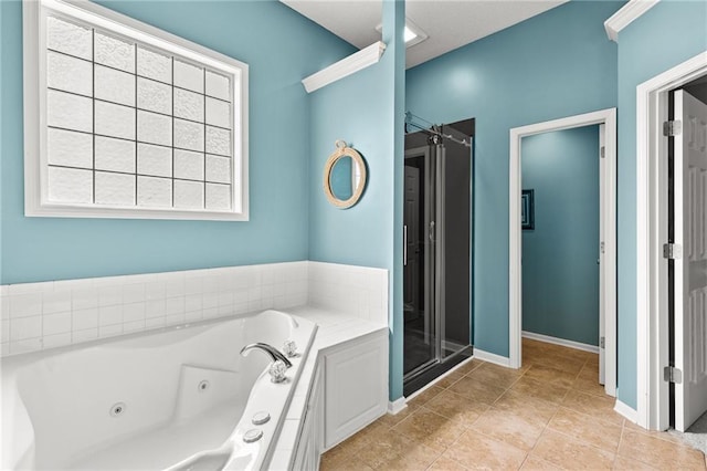 9820 N Donnelly Ave, Kansas City, MO 64157 - full bath with a whirlpool tub, a shower stall, tile patterned flooring, and baseboards