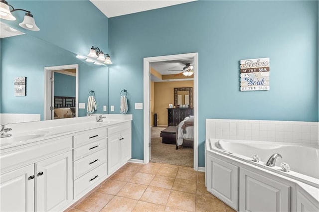 9820 N Donnelly Ave, Kansas City, MO 64157 - ensuite bathroom featuring ceiling fan, a bath, double vanity, tile patterned floors, and baseboards