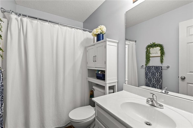 9820 N Donnelly Ave, Kansas City, MO 64157 - bathroom featuring a textured ceiling, toilet, vanity, and curtained shower