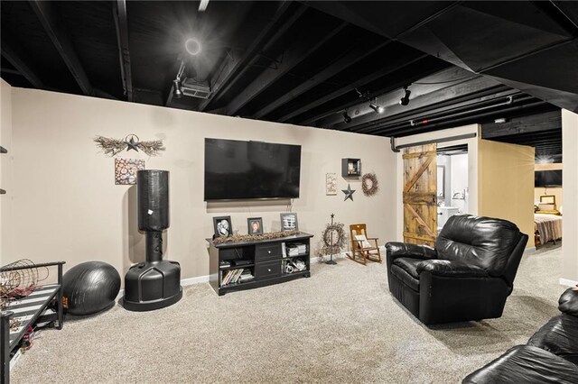 9820 N Donnelly Ave, Kansas City, MO 64157 - living area featuring carpet floors, baseboards, and a barn door