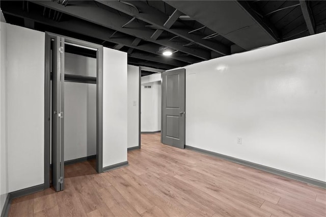 2317 S Maywood Ave, Independence, MO 64052 - finished basement with light wood-style floors and baseboards