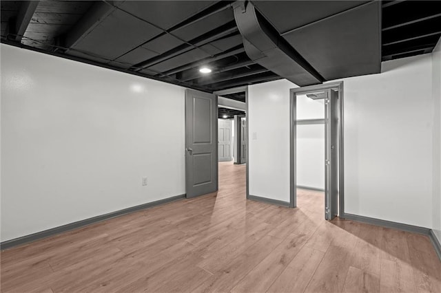 2317 S Maywood Ave, Independence, MO 64052 - finished basement featuring light wood-style floors and baseboards