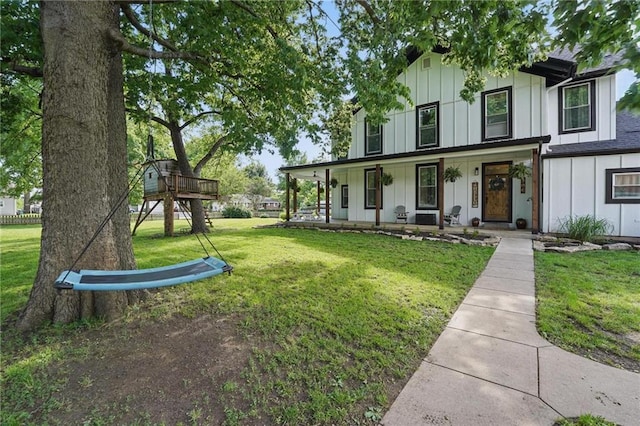 906 E Piankishaw St, Paola, KS 66071 - modern inspired farmhouse featuring board and batten siding, covered porch, and a front yard