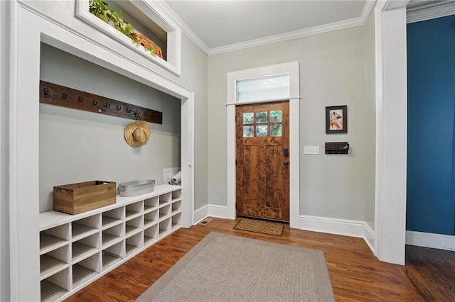 906 E Piankishaw St, Paola, KS 66071 - mudroom with crown molding, baseboards, and wood finished floors