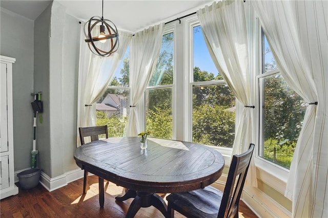 906 E Piankishaw St, Paola, KS 66071 - dining room featuring baseboards and dark wood finished floors