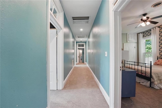906 E Piankishaw St, Paola, KS 66071 - hall featuring carpet, attic access, and baseboards