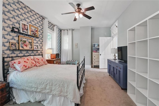906 E Piankishaw St, Paola, KS 66071 - bedroom with light colored carpet and ceiling fan