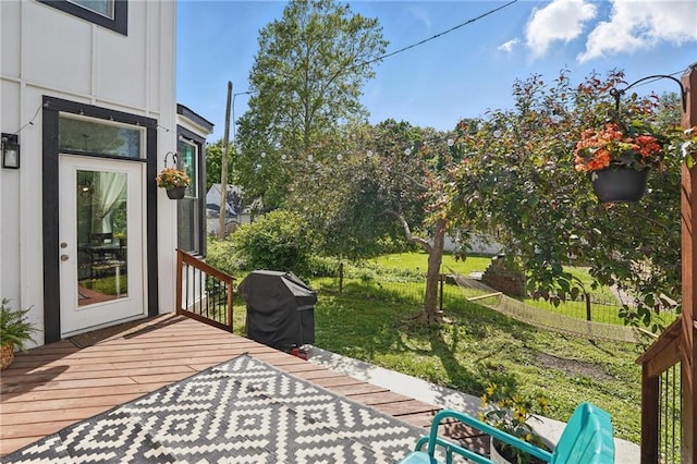 906 E Piankishaw St, Paola, KS 66071 - deck with a grill and a yard