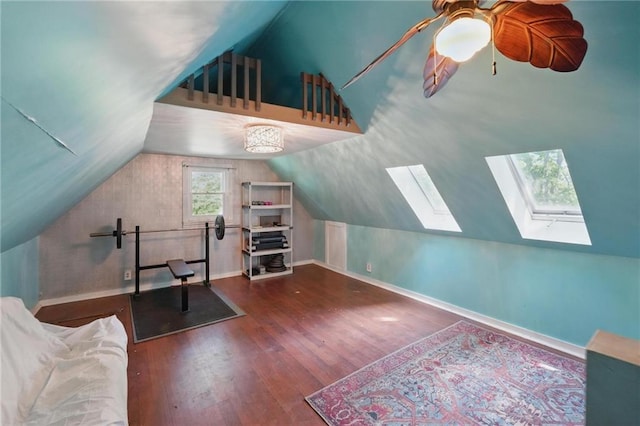 906 E Piankishaw St, Paola, KS 66071 - office featuring vaulted ceiling, wood finished floors, baseboards, ceiling fan, and a skylight
