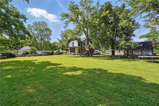 906 E Piankishaw St, Paola, KS 66071 - view of yard with a trampoline