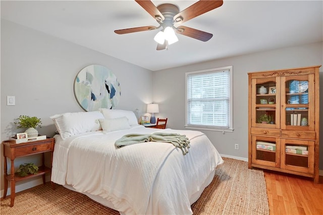 6016 W 85th St, Overland Park, KS 66207 - bedroom featuring light wood-style floors, ceiling fan, and baseboards